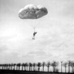 1912 Capt Albert Berry makes the 1st parachute jump from an airplane