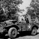 37 mm Gun M3 mounted aboard a M6 Gun Motor Carriage, with additional .50 cal machine gun attached, 3 miles west of Watertown, Tennessee, United States, 6 Jun 1943