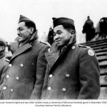 Yamane (right) and two other soldiers enjoy a University of Wisconsin football game in November 1942. (Yamane Family Collection)