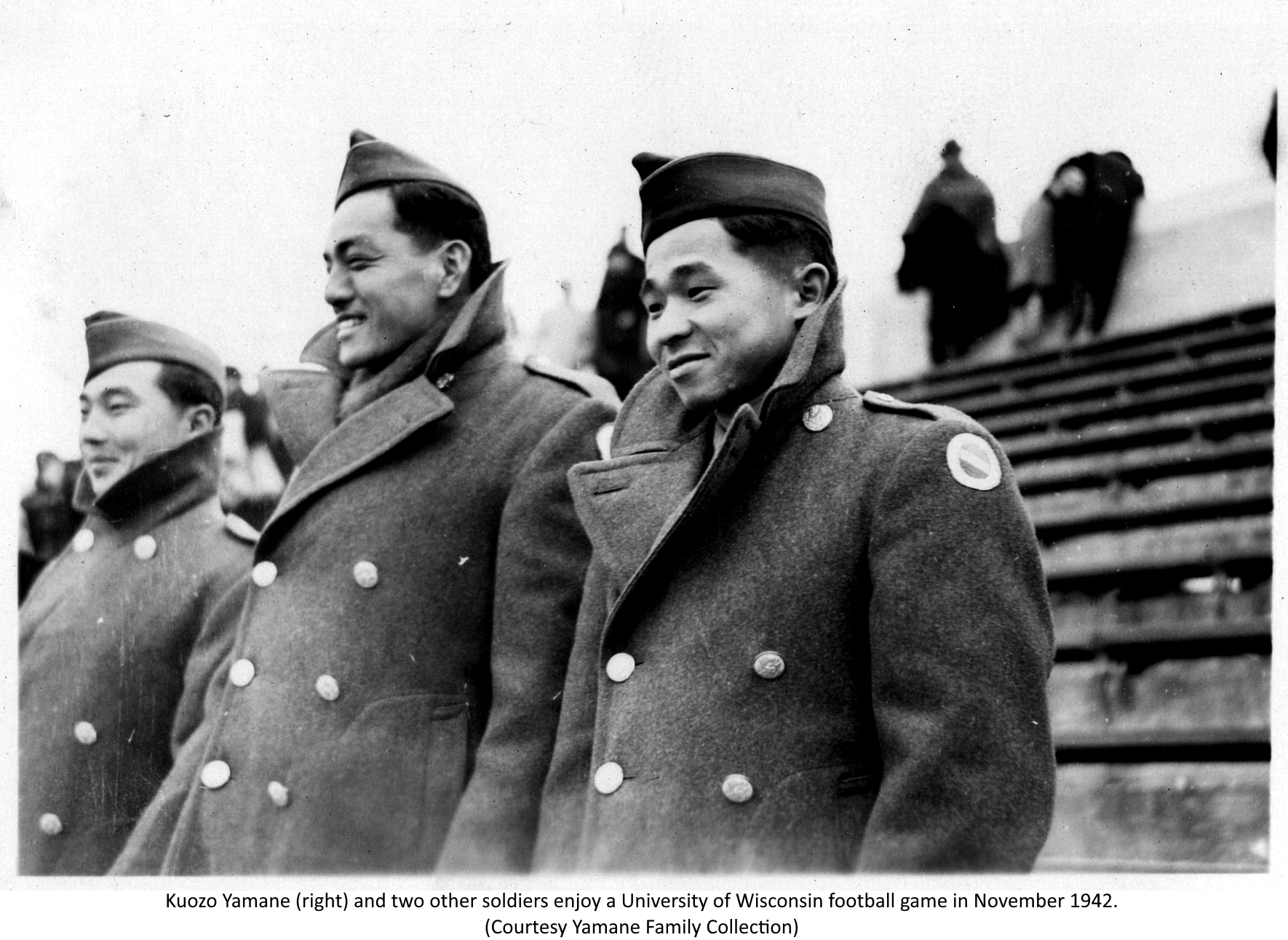 Yamane (right) and two other soldiers enjoy a University of Wisconsin football game in November 1942. (Yamane Family Collection