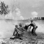 88-ID (H-2350) Monterumici April 1945-007-Three US soldiers firing a 57-MM Gun M-1 while the 88-ID crosses the Po River,April 24 1945