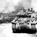(EUCMH)-Dragoon-004-An American Sherman tank crew scans for Germans retreating up the Rhône Valley in southern France. 1944
