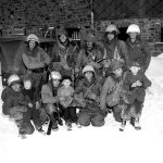 Men of the 2nd Infantry Division with children from Muringen (Krinkelt-Rocherath)
