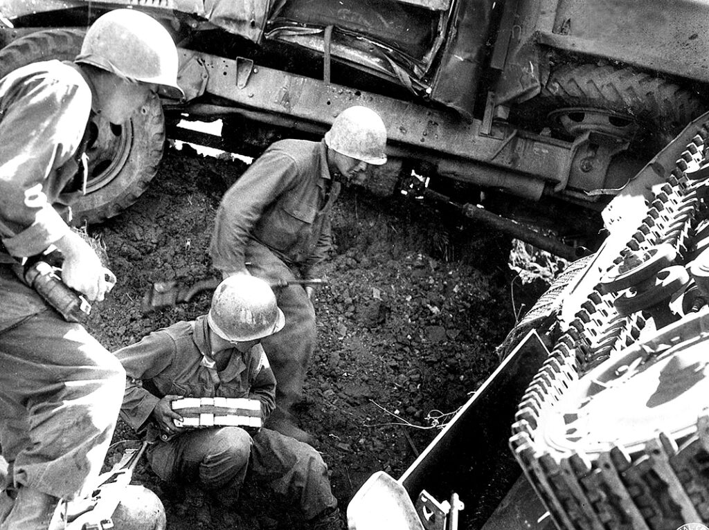 To prevent the Japanese from recovering their stranded vehicles during the night, patrols used explosive charges to destroy the enemy equipment. To prevent the Japanese from recovering their stranded vehicles during the night, patrols used explosive charges to destroy the enemy equipment