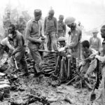 23rd Division troops inspect captured Japanese ordnance, Imphal, 1944