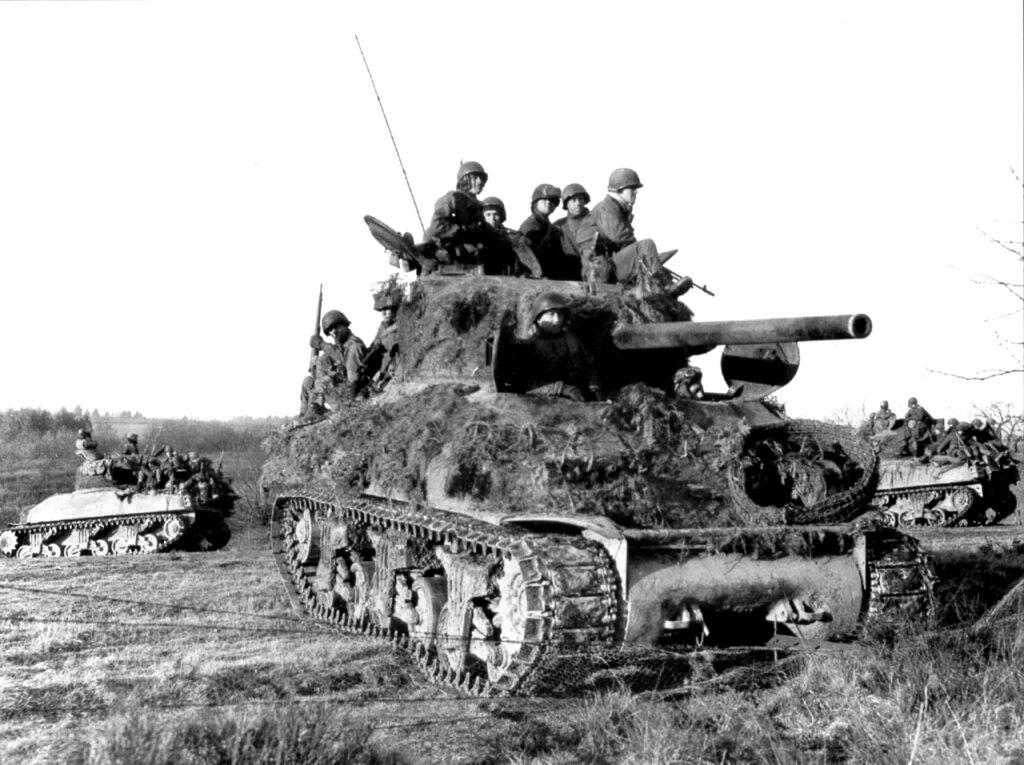 7th Armored M-4 patroling the area file protection the left flank of the column