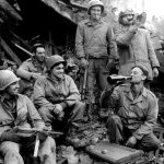 3-A Troops celebrate the capture of St Avold. L-R Pvt. Frank Manzi, Cpl Carl Cipriano, Cpl Luke Kowalcheck, Pvt Rocci Jacullo, Pvt Al D’amore and Cpl Philip Ellamore- Dec 6 1944 (scaled)