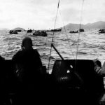 Amphibious tractors carrying the 1st Battalion, 305th Infantry, 77th Division, head for the beaches of Zamami Shima, March 26, 1945.