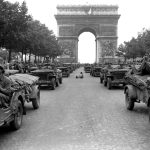 Jeeps of the American 28th Infantry Division Moving Down the Champs Elysees in Paris, France