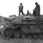 Men of the 28th Infantry Division search for souvenirs on a early November 43 production StuG.III Ausf.G on November 24th 1944-scaled