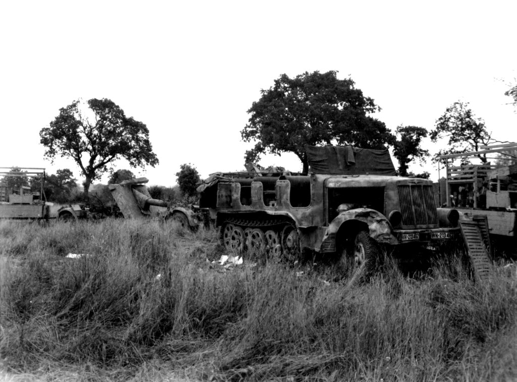 A convoy of motorized German equipment more than two miles long was destroyed by US air action at  St Martin de Cenilly, Normandie, France. 1944