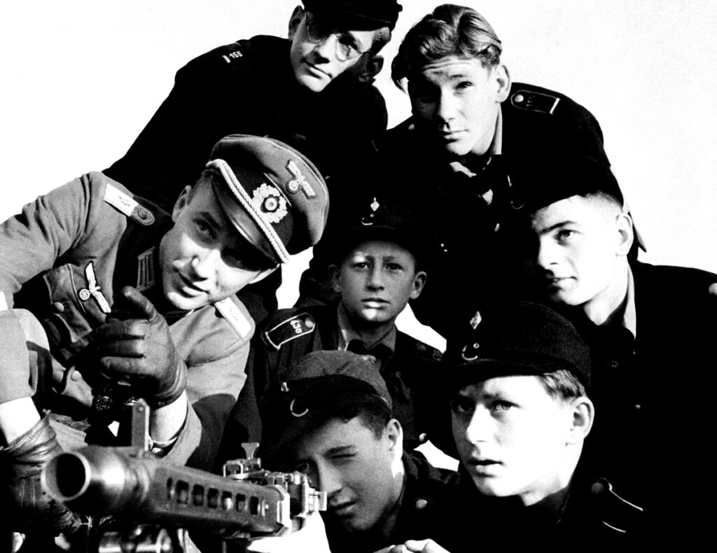 A group of Hitler youth receives instruction in the use of a machine-gun, somewhere in Germany, December 1944