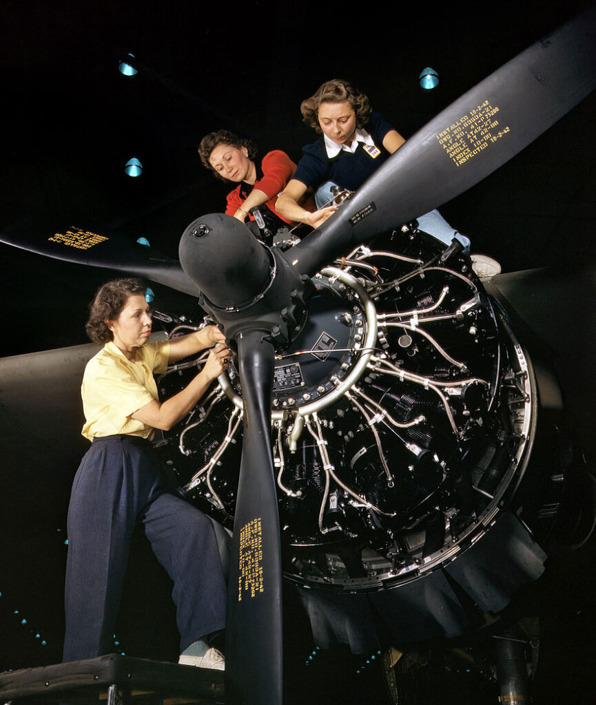 October 1942. Engine installers at Douglas Aircraft in Long Beach, California