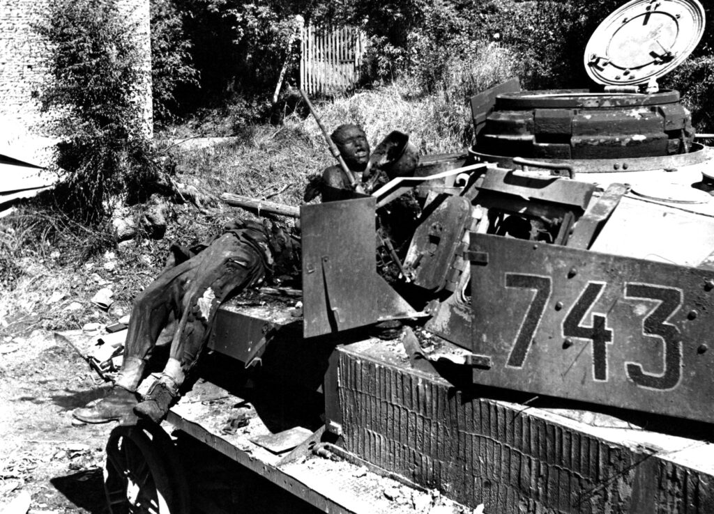 (War is Hell) Burnt out Pz.Kpfw. IV and crew during the Battle of the Falaise Pocket, August 1944