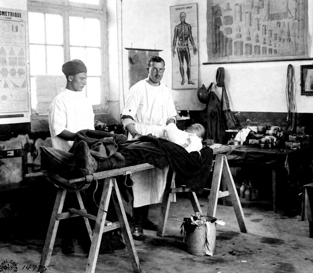 PFC John A. Coolidge, of 1st Field Battalion, Signal Corps, being operated on at 1st Field Hospital Unit, Bezu, France, June 16, 1918 (Source 2nd-division.com)