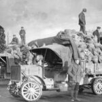 Soldiers unloading clothing and shoes to be repaired at the Quartermaster Corps Salvage Depot in Saone-et-Loire, France
