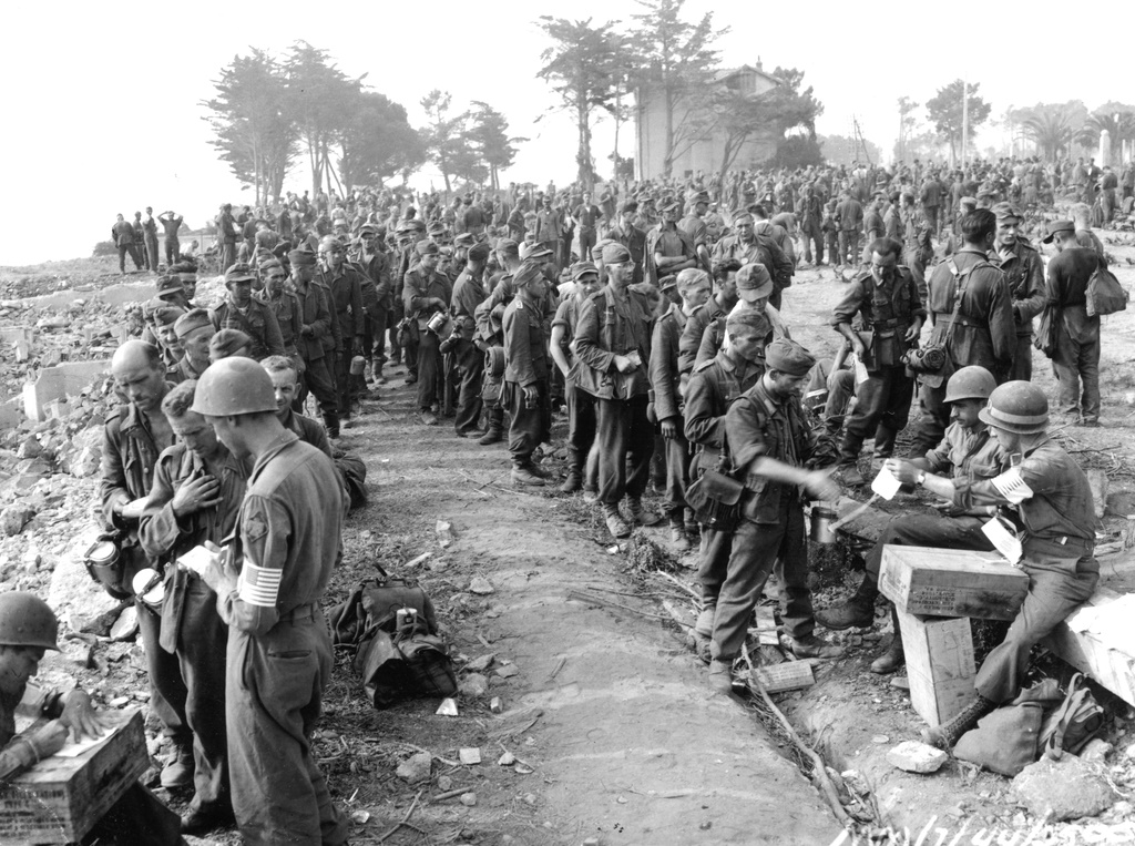 American MPs tabulating droves of Nazi prisoners near St Tropez Southern France Invasion August 1944 American MPs tabulating droves of Nazi prisoners near St Tropez Southern France Invasion August 1944