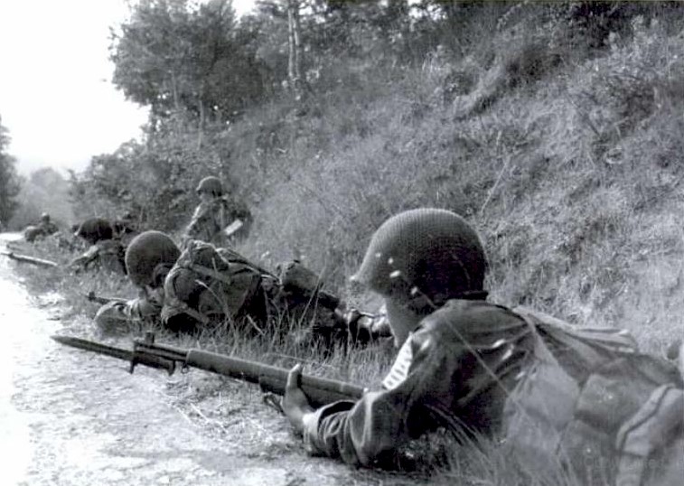 Fox Company troopers progressing in enemy territory, August 1944 Fox Company troopers progressing in enemy territory, August 1944