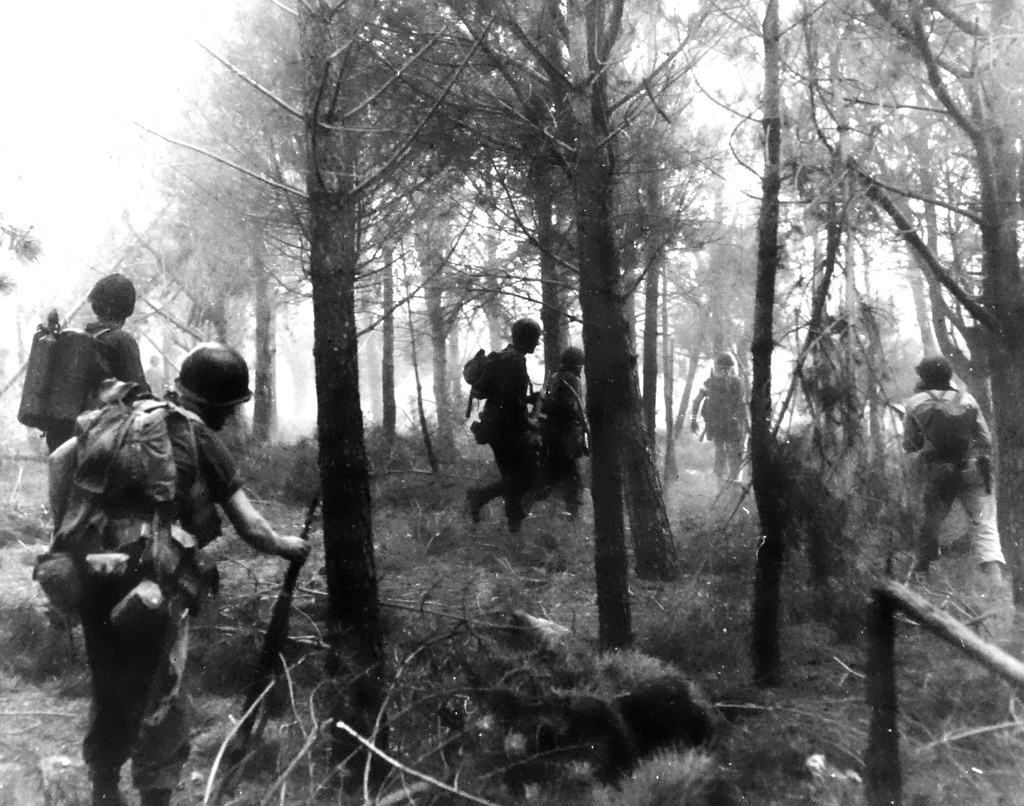 Invasion of Southern France, August 1944. US Army soldiers push inland from practically an uncontested landing on coast of Southern France. These soldiers press the advance through a forest, with their eyes and ears alert for any sign of the foe. Though unidentified, these soldiers are probably from the Seventh Army Invasion of Southern France, August 1944. US Army soldiers push inland from practically an uncontested landing on coast of Southern France. These soldiers press the advance through a forest, with their eyes and ears alert for any sign of the foe. Though unidentified, these soldiers are probably from the Seventh Army