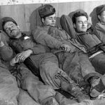 Illustration – Men sleeping after heavy combats