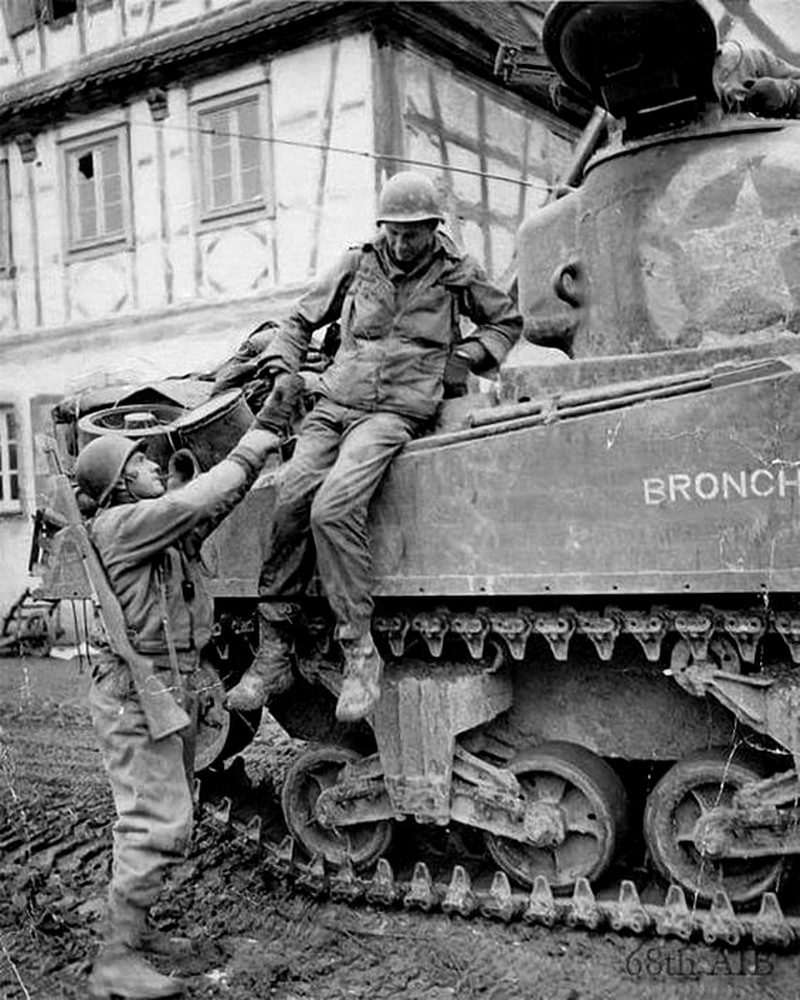 PFC Ray F. Lohof, 'B' Company, 68th Armored Infantry Battalion, 14th Armored Division being helped off a tank after the battle of Ober-Otterbach, 18 December 1944 PFC Ray F. Lohof, 'B' Company, 68th Armored Infantry Battalion, 14th Armored Division being helped off a tank after the battle of Ober-Otterbach, 18 December 1944