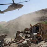 U.S. soldiers waiting to be evacuated by helicopter after their armoured vehicle was struck by an improvised explosive device, Afghanistan, 2009