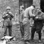 Fallschirmjäger taking a break during fighting in Normandy (Note the G-41 Rifle and the AT Magnetic Mines)