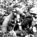 German paratroopers firing a 8 cm shell with the 8 cm mortar (short barrel) small mortar. France June 1944