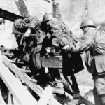Paratroopers of the 6.Fallschimjäger-Regiment move into position during the fighting for Hill 30 and Carentan
