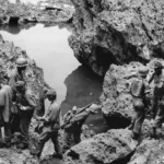 7th Infantry Division troops conduct mop-up operations on Okinawa to capture the by-passed Nips