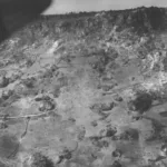 Soldiers of the 382nd Infantry Regiment, 96th Infantry Division, inched up a hill against heavy Japanese resistance during the final days of the Battle of Okinawa (AUSF-NARA)