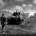 Soldiers of the U.S. 96th Infantry Division advance on a Japanese position on the island of Okinawa, 1945