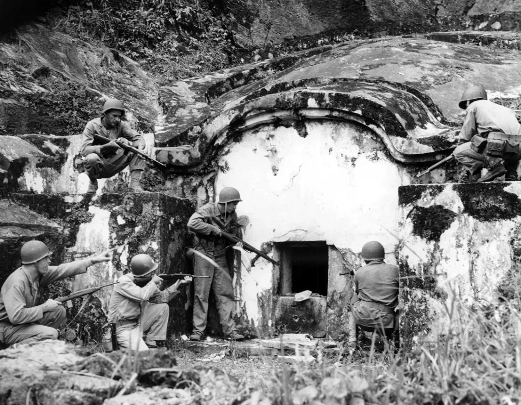 Battle of Okinawa -May 1945 - Men clearing a traditional burial tomb during the Battle