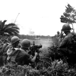 Heavy machine guns of 96th Division fire on Japanese positions on the southern front of Okinawa. 4 April, 1945. 96th Infantry Division