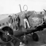 American servicemen inspect a captured German Ju 52 transport plane