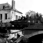 DUKWs cross a Bailey bridge at Pacy-sur-Eure, France, August 1944