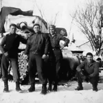 823-TDB Four men at their covered TD