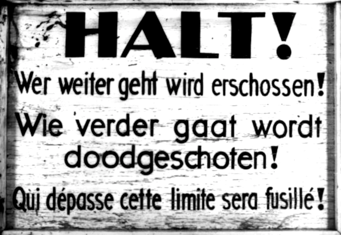 A sign outside the Breendonk transit camp warning that trespassers will be shot. Breendonk, Belgium, 1940-1944 A sign outside the Breendonk transit camp warning that trespassers will be shot. Breendonk, Belgium, 1940-1944