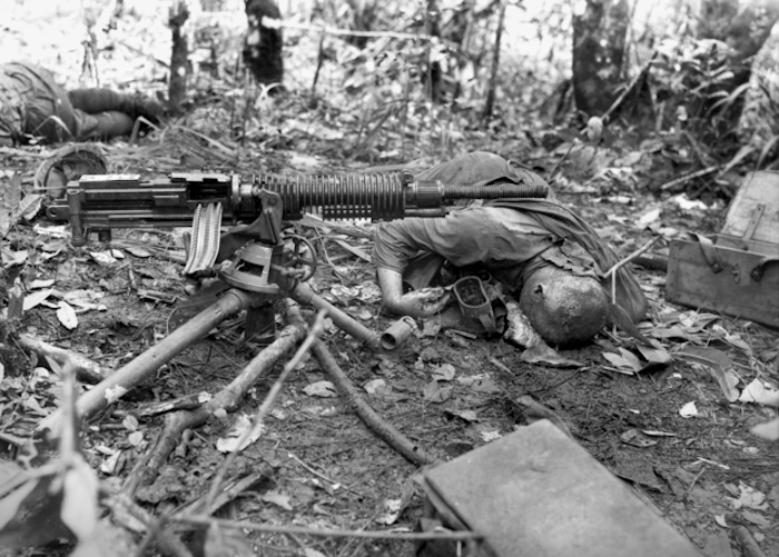 (Casualties on both sides) A-Japanese-7.7-MM-Type-92-Woodpecker-Machine-gun-and-eliminated-crew.webp