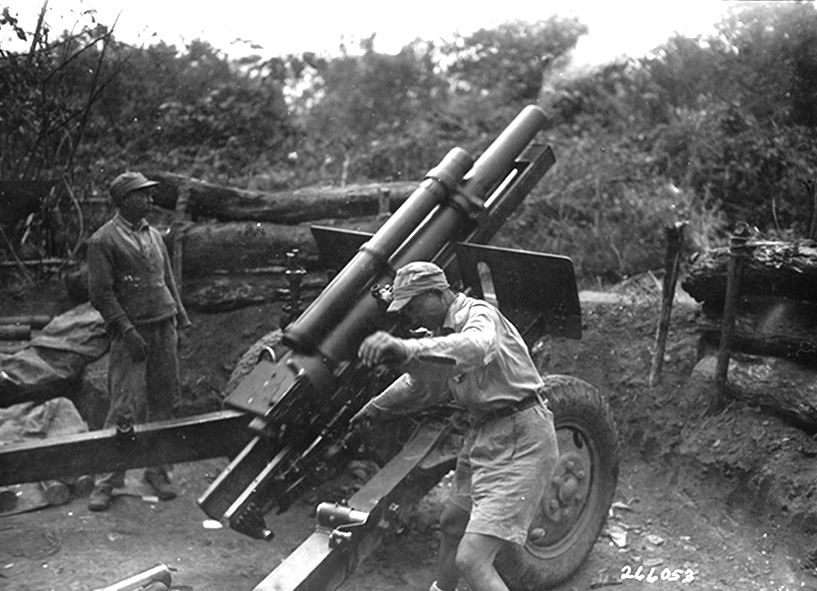 Chinese artillery fire on Japanese positions (105-MM HOW) Vicinity Myitkyina Burma