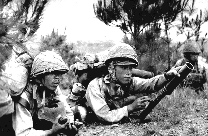 Japs using a knees mortar Burma 1944