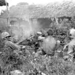 Soldiers of the 5307 (C) (P) fires an M-1917A1 BMG water cooled machine gun at Japanese forces – (Battle of Myitkyina – Burma July 1944