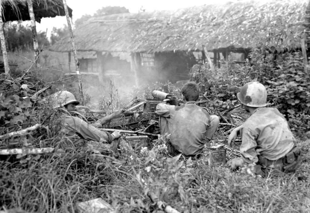 Soldiers of the 5307 (C) (P) fires an M-1917A1 BMG water cooled machine gun at Japanese forces - (Battle of Myitkyina - Burma July 1944