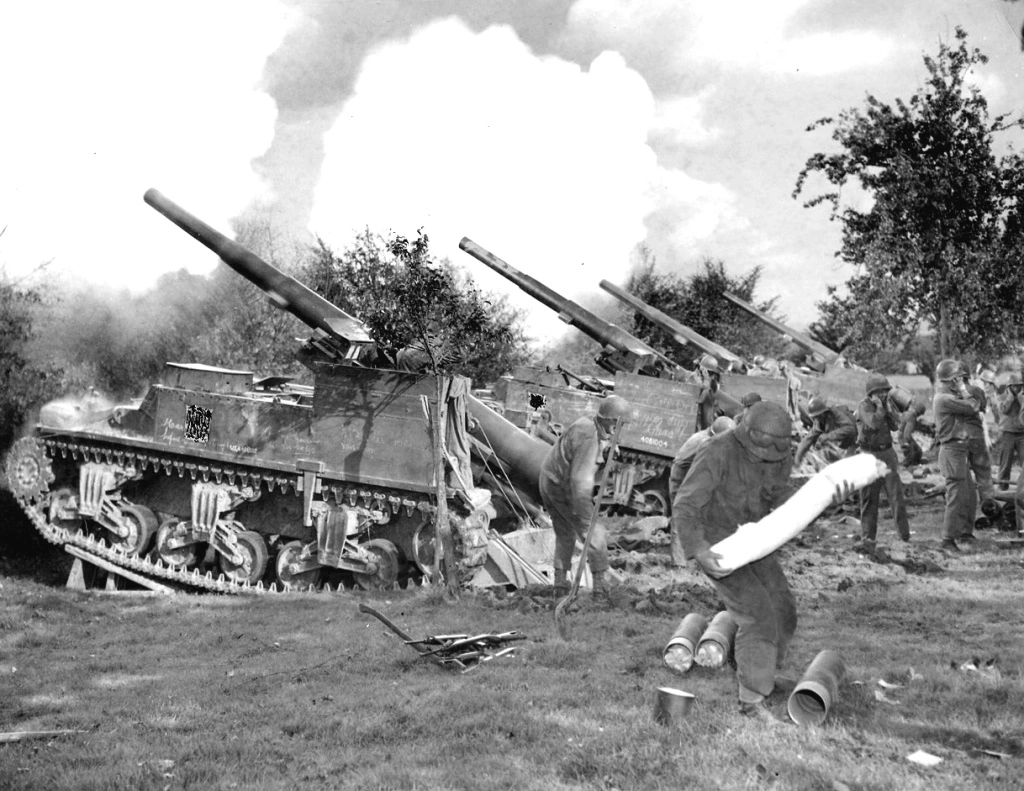 battery-of-American-155mm.-self-propelled-guns-mounted-on-Sherman-tank-chassis-as-they-fired-into-the-village-of-Bildehen-Germany-which-is-located-six-kilometers-southwest-of-Aachen-on-the-Liege-Aachen-road.jpg battery-of-American-155mm.-self-propelled-guns-mounted-on-Sherman-tank-chassis-as-they-fired-into-the-village-of-Bildehen-Germany-which-is-located-six-kilometers-southwest-of-Aachen-on-the-Liege-Aachen-road