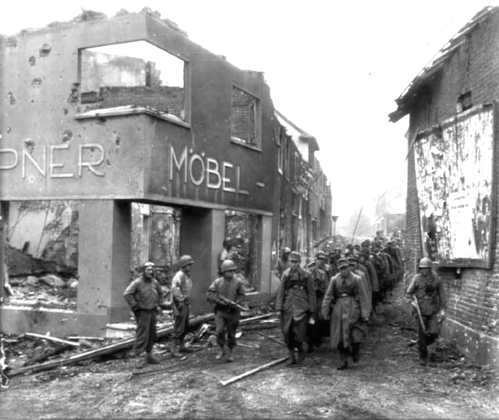 U.S. Army soldiers with the 117th Infantry Regiment, 30th Infantry Division and 2nd Armored Division usher captured German troops near the Siegfried Line in Palenburg, Germany, Oct. 1, 1944 U.S. Army soldiers with the 117th Infantry Regiment, 30th Infantry Division and 2nd Armored Division usher captured German troops near the Siegfried Line in Palenburg, Germany, Oct. 1, 1944