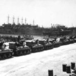 2-AD-EUCMH-Operation Husky-Sicily-1943-M-4 Sherman tanks being loaded onto LSTs for Operation Husky, Pêcherie, Bizerte, Tunisia.