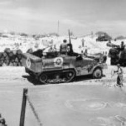 2-AD-EUCMH-Operation Husky-Sicily-1943-U.S. Coast Guardsmen unload the supplies that back up the infantry as the invasion of Sicily continues. Sicily July 1943