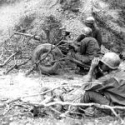 A 37mm anti-tank gun prepares to fire point-blank at a Japanese pillbox on Conical Hill on Okinawa. The 383rd Infantry Regiment of the Army’s 96th Infantry Division found this small weapon effective.
