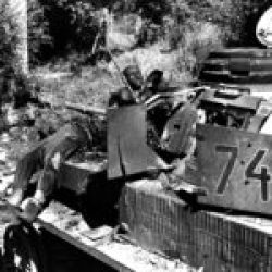 Burnt out Pz.Kpfw. IV and crew during the Battle of the Falaise Pocket, August 1944