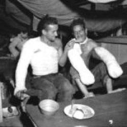 Christmas US-Army-Sgt.-Edward-F.-Good-feeding-Pfc.-Lloyd-Demin-during-the-Christmas-dinner-at-a-field-hospital-in-the-Philippine-Islands-25-Dec-1944